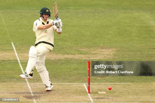 Steve Smith of Australia pulls the ball away during day three of the Fifth Test in the Ashes series between Australia and England at Blundstone Arena...
