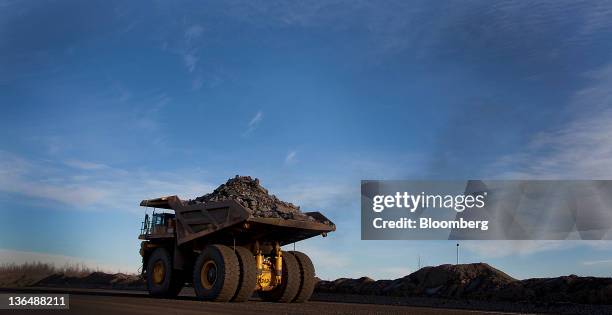 Ton capacity production truck transports a load of taconite from an open pit mine to the Hibbing Taconite Co. Pellet manufacturing plant, operated by...