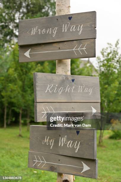 homemade wooden directional signs reading right way, wrong way, and my way - consequences stock pictures, royalty-free photos & images