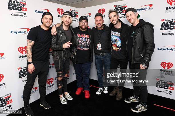 Woody and Booker pose with Rian Dawson, Alex Gaskarth, Jack Barakat, and Zack Merrick of All Time Low during the 2022 iHeartRadio ALTer EGO presented...