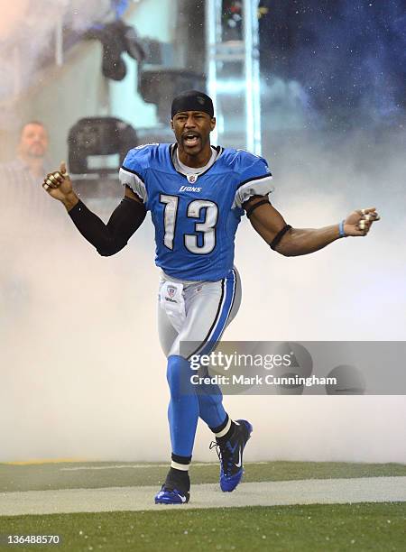 Nate Burleson of the Detroit Lions runs onto the field during player introductions before the game against the San Diego Chargers at Ford Field on...