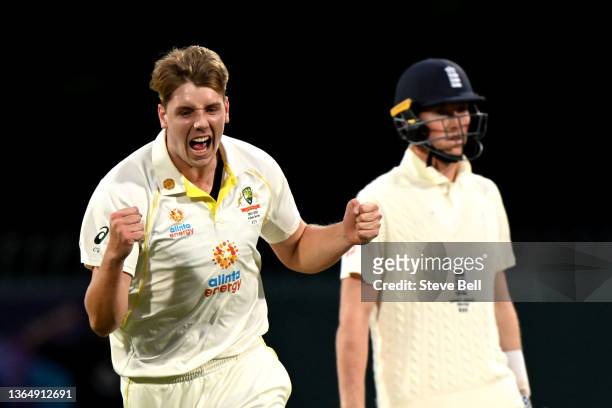 Cameron Green of Australia celebrates after bowling Dawid Malan of England out during day three of the Fifth Test in the Ashes series between...