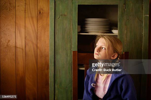girl sitting against paneled wall - sewanee fotografías e imágenes de stock
