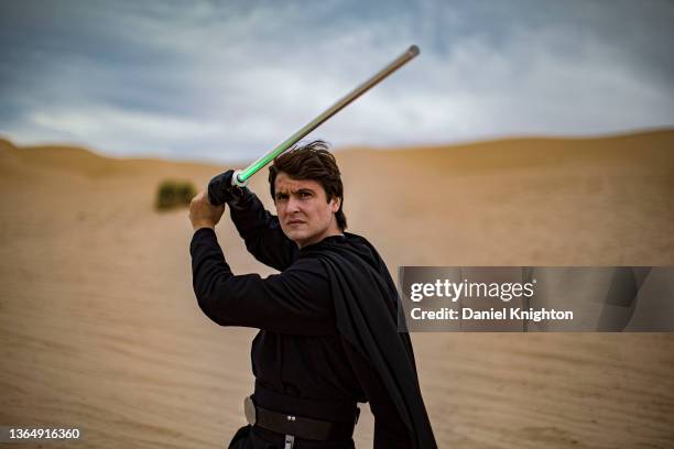 Star Wars cosplayer Austin Verberg as Luke Skywalker poses for photos at Buttercup Sand Dunes on January 15, 2022 in Winterhaven, California....