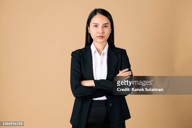 studio waist up portrait of a beautiful businesswoman with arms crossed - woman waist up isolated stock pictures, royalty-free photos & images