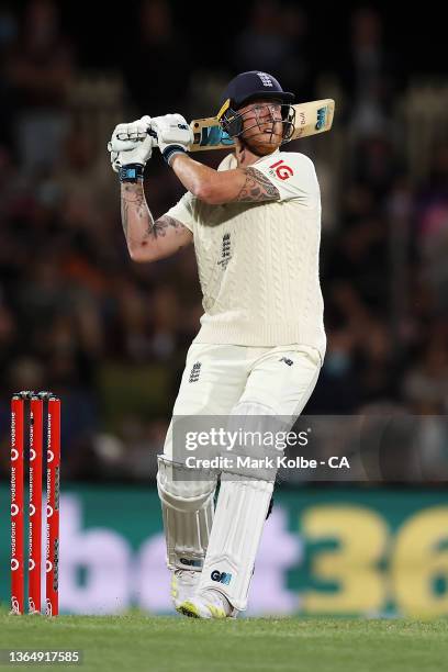 Ben Stokes of England hits the ball into the outfield before being caught by Nathan Lyon of Australia during day three of the Fifth Test in the Ashes...