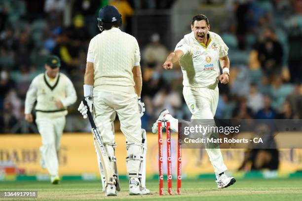 Scott Boland of Australia celebrates the wicket of England captain Joe Root during day three of the Fifth Test in the Ashes series between Australia...