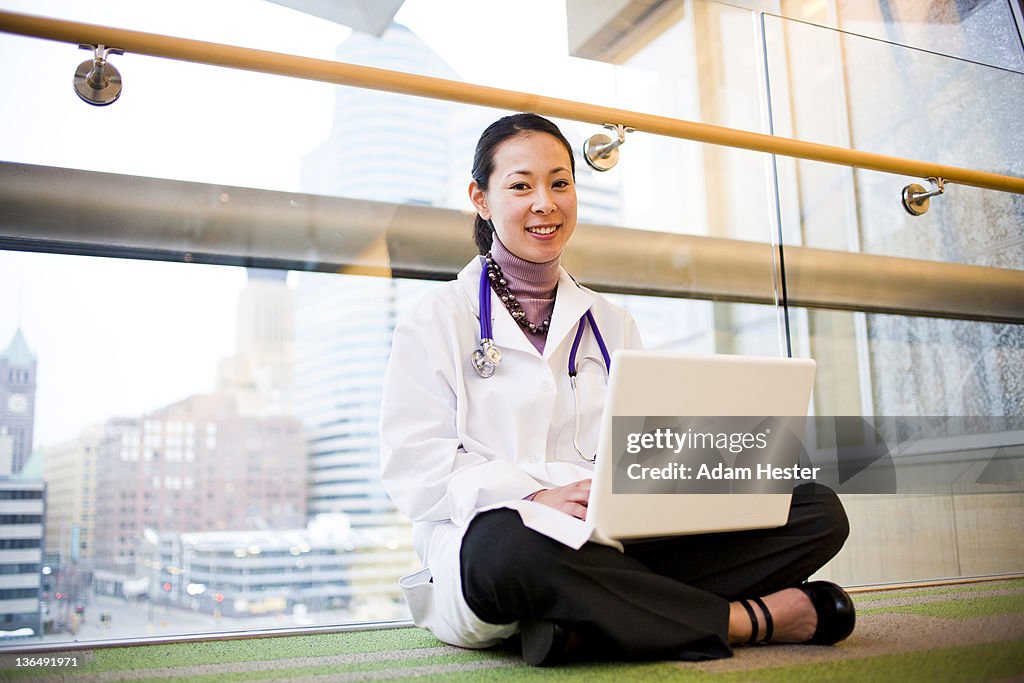 Female doctor using a laptop computer.