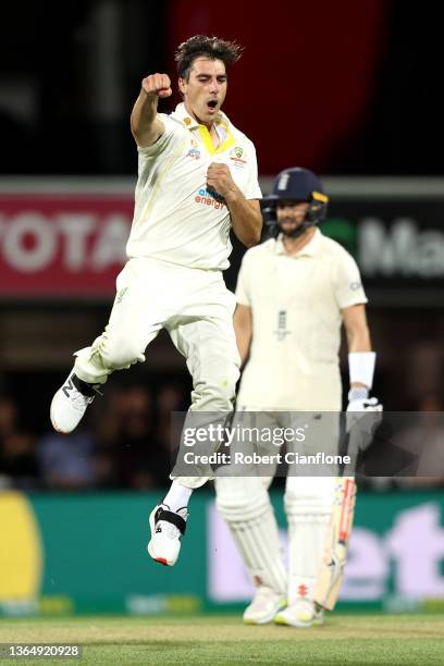 Pat Cummins of Australia celebrates the wicket of Ollie Pope of England during day three of the Fifth Test in the Ashes series between Australia and...