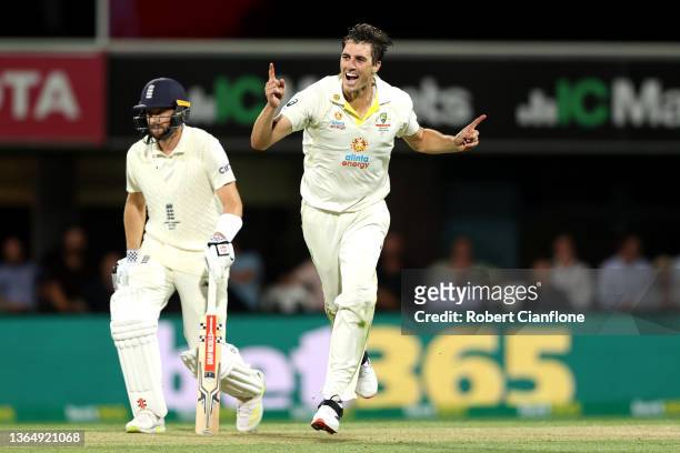 Pat Cummins of Australia celebrates the wicket of Ollie Pope of England during day three of the Fifth Test in the Ashes series between Australia and...