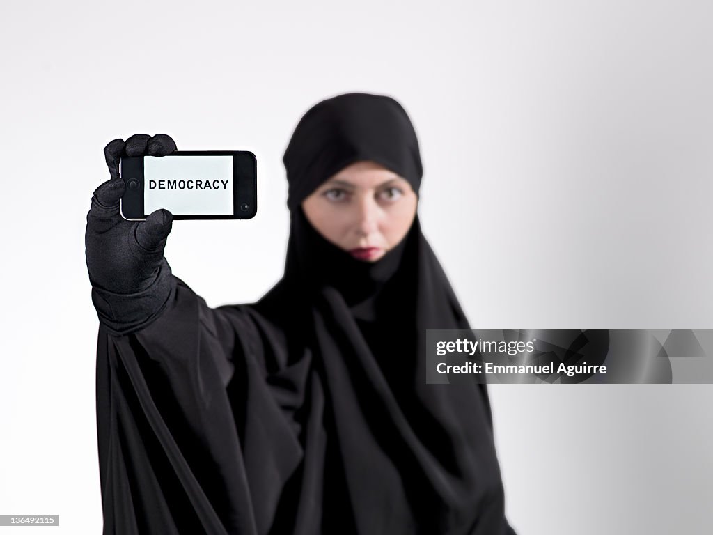 Arabian woman activist with cell phone