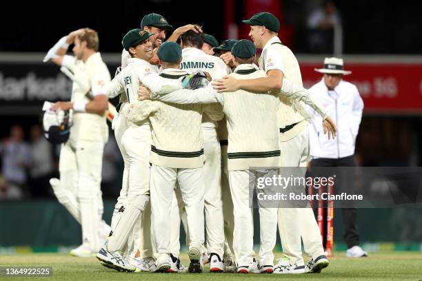 Pat Cummins of Australia celebrates the wicket of Ollie Robinson of England during day three of the Fifth Test in the Ashes series between Australia...