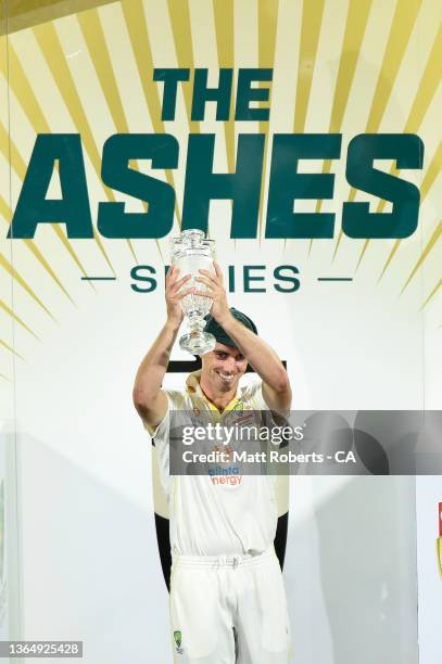 Australian captain Pat Cummins holds the trophy aloft after winning the Fifth Test in the Ashes series between Australia and England at Blundstone...