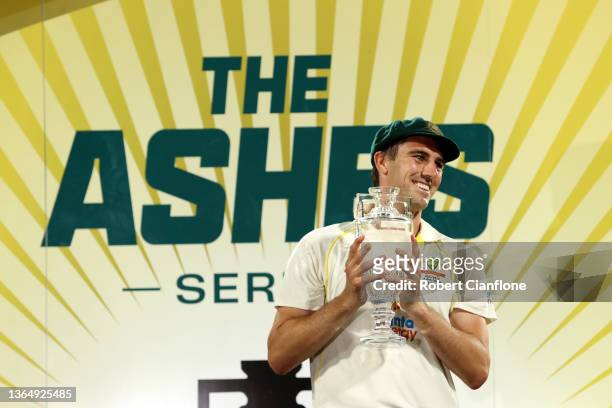 Pat Cummins of Australia celebrates with the Ashes trophy after winning the Fifth Test in the Ashes series between Australia and England at...