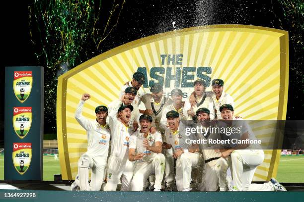 Australia celebrate after winning the Fifth Test in the Ashes series between Australia and England at Blundstone Arena on January 16, 2022 in Hobart,...