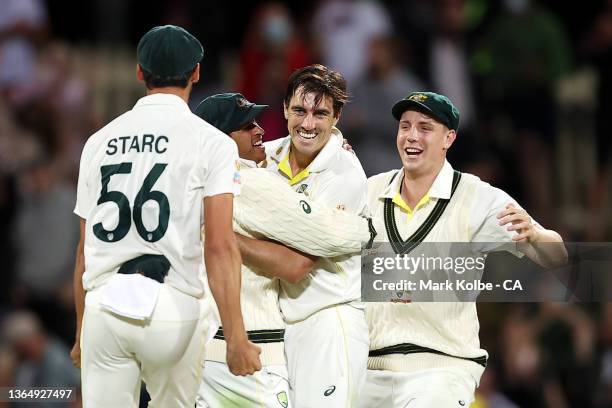 Mitchell Starc, Usaman Khawaja, Pat Cummins and Cameron Green of Australia celebrate victory during day three of the Fifth Test in the Ashes series...