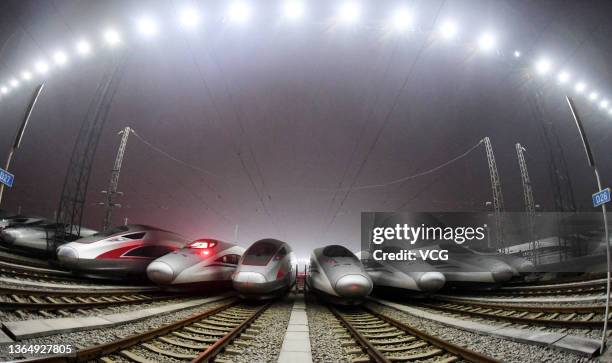 High-speed railway trains park at a bullet train depot in the early morning of January 16, 2022 in Wuhan, Hubei Province of China. China's spring...
