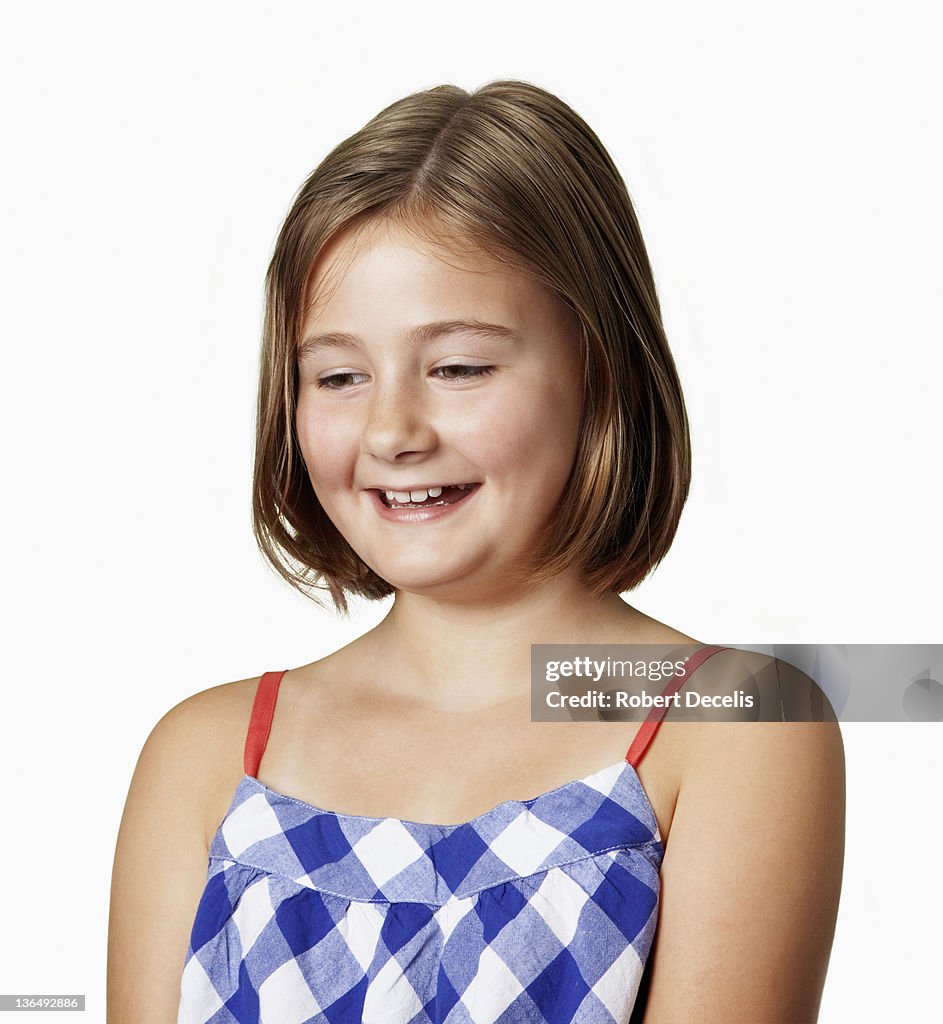 Portrait of young girl side on to camera