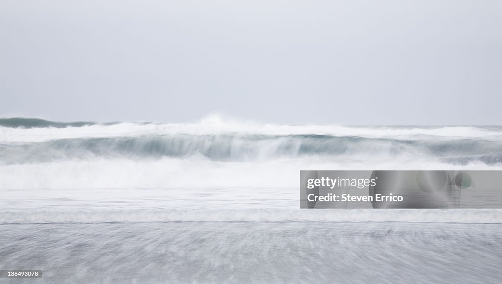 Waves breaking on beach, (motion-blur)