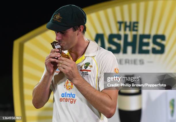 Pat Cummins of Australia kisses a replica of the Ashes urn after Australia won the Ashes series between Australia and England 4-0 at Blundstone Arena...