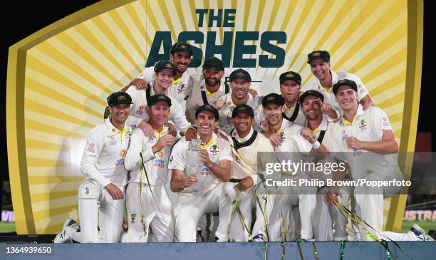 Pat Cummins celebrates with the Australia players after they won the Ashes series between Australia and England 4-0 at Blundstone Arena in Hobart,...