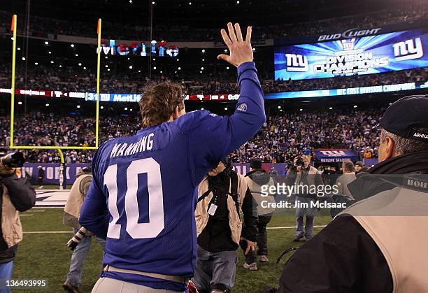 Eli Manning of the New York Giants celebrates after defeating the Dallas Cowboys on January 1, 2012 at MetLife Stadium in East Rutherford, New...