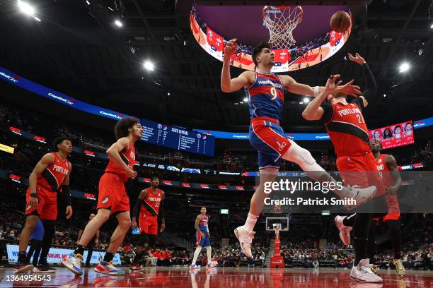 Jusuf Nurkic of the Portland Trail Blazers and Deni Avdija of the Washington Wizards battle for a rebound during the first half at Capital One Arena...