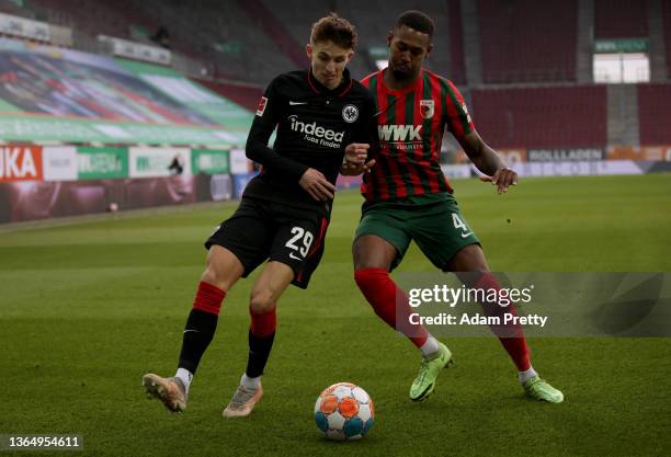 Reece Oxford of FC Augsburg challenges Jesper Lindstrøm of Eintracht Frankfurt during the Bundesliga match between FC Augsburg and Eintracht...