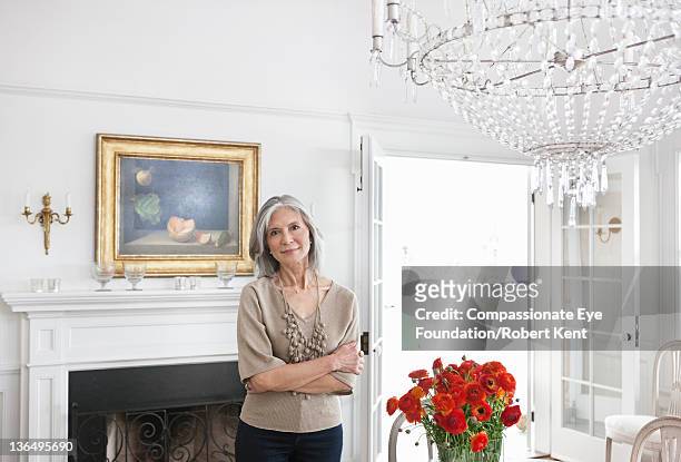mature woman in dining room, portrait, smiling - cef do not delete stock pictures, royalty-free photos & images