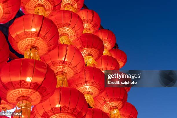 neatly hung red lanterns - kung hei fat choi stock-fotos und bilder