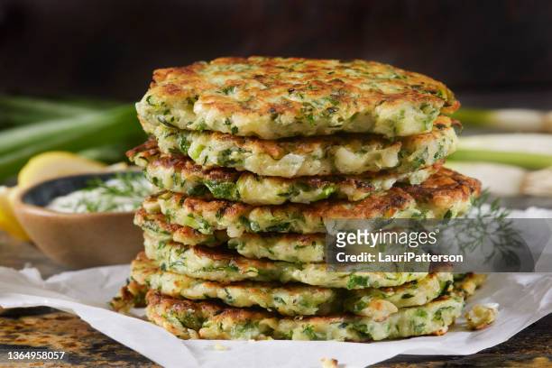 greek zucchini and feta fritters - fried potato stock pictures, royalty-free photos & images