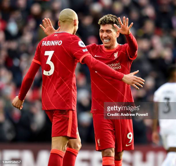 Fabinho of Liverpool celebrates after scoring the opening goal with Roberto Firmino of Liverpool during the Premier League match between Liverpool...