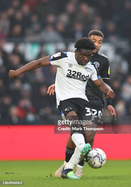 Fest Ebosele of Derby County beats Jayden Bogle of Sheffield United to the ball during the Sky Bet Championship match between Derby County and...