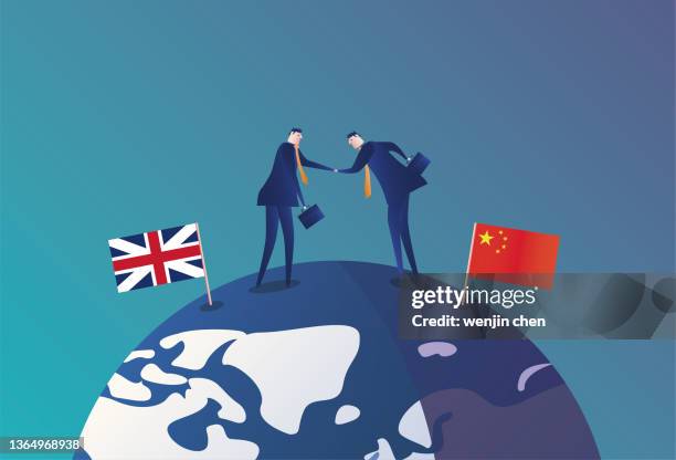 british business men and chinese business men shake hands on the earth and develop together - ambassador vector stock illustrations