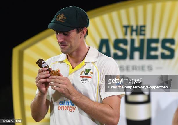 Pat Cummins with a replica of the Ashes urn after Australia won the Fifth Test in the Ashes series between Australia and England at Blundstone Arena...