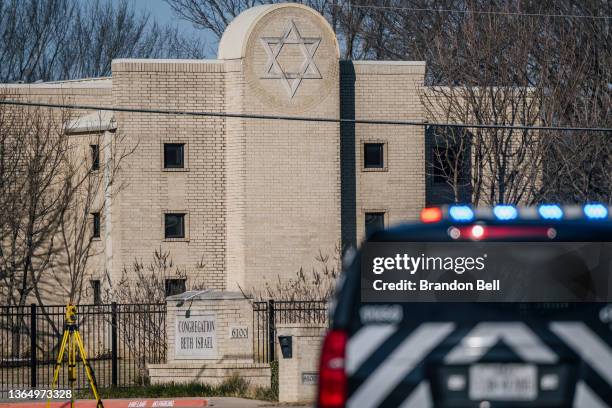 Law enforcement vehicle sits in front of the Congregation Beth Israel synagogue on January 16, 2022 in Colleyville, Texas. All four people who were...