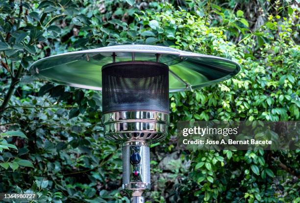 terrace gas heater on the street. - electric heater stock pictures, royalty-free photos & images