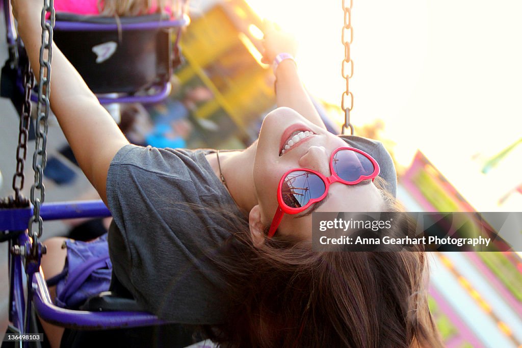 Young girl sitting on swing
