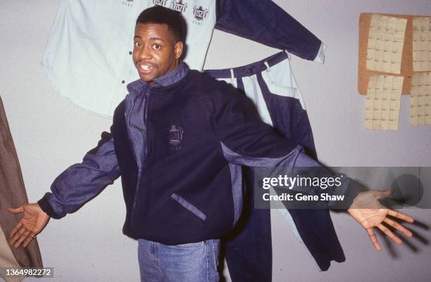 Potrait of American rapper and clothing designer Dana Dane as he poses in some of his clothing designs, New York, New York, January 1992. The store,...