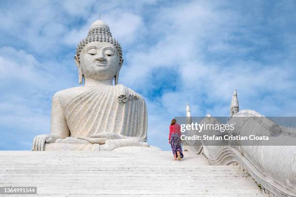 white marble statue of phuket big buddha by blue sky in thailand - phuket ストックフォトと画像