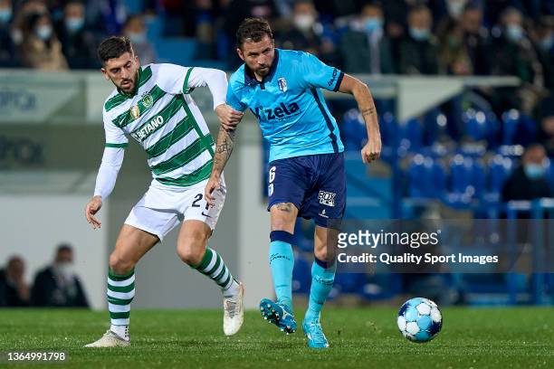 Paulinho of Sporting CP competes for the ball with Claudemir Domingues de Souza of FC Vizela during the Liga Portugal Bwin match between FC Vizela...