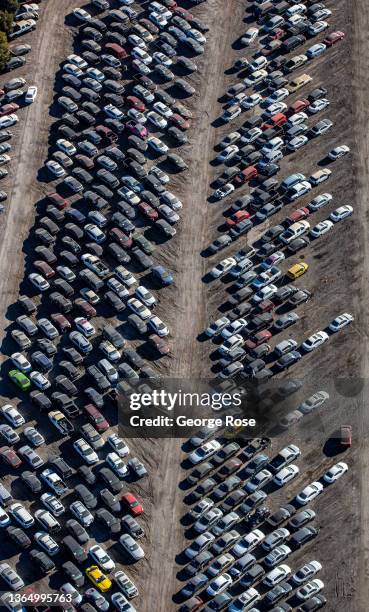 Thousands of damaged and discarded vehicles are jammed into a junkyard as viewed from above the Boulder City Parkway on January 11, 2022 in...