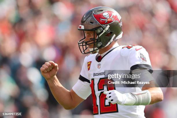 Tom Brady of the Tampa Bay Buccaneers celebrates a touchdown against the Philadelphia Eagles during the first quarter in the NFC Wild Card Playoff...