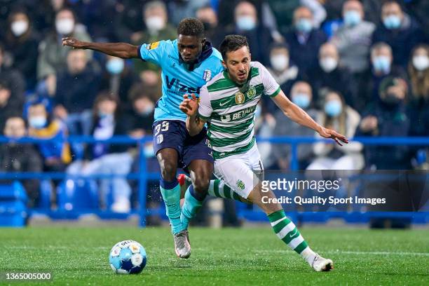 Koffi Kouao of FC Vizela competes for the ball with Pablo Sarabia of Sporting CP during the Liga Portugal Bwin match between FC Vizela and Sporting...