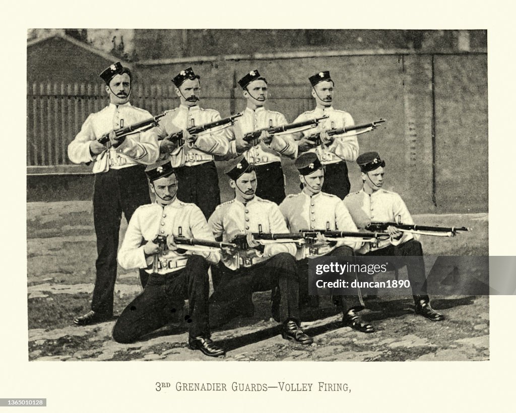 British Army soldiers in rank volley firing, 3rd Grenadier Guards, Military uniform, Victorian 19th Century