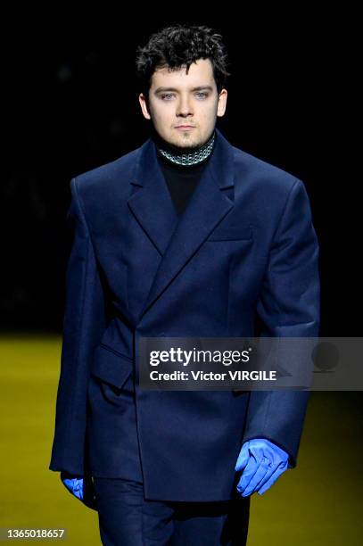 Asa Butterfield walks the runway during the Prada Ready to Wear Fall/Winter 2022-2023 fashion show as part of the Milan Men Fashion Week on January...