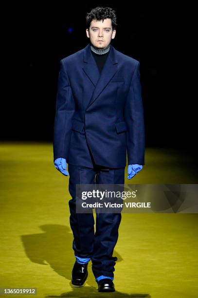 Asa Butterfield walks the runway during the Prada Ready to Wear Fall/Winter 2022-2023 fashion show as part of the Milan Men Fashion Week on January...