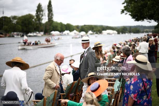 Spectators watch a race on the River Thames at the Henley Royal Regatta in Henley-on-Thames, west of London, on June 30, 2023.