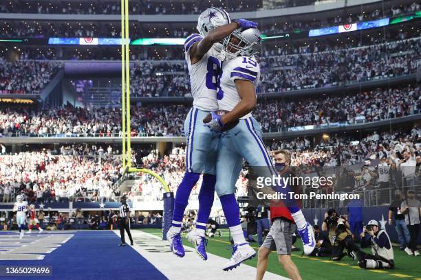 Amari Cooper of the Dallas Cowboys celebrates his touchdown against the San Francisco 49ers with teammate CeeDee Lamb during the second quarter in...