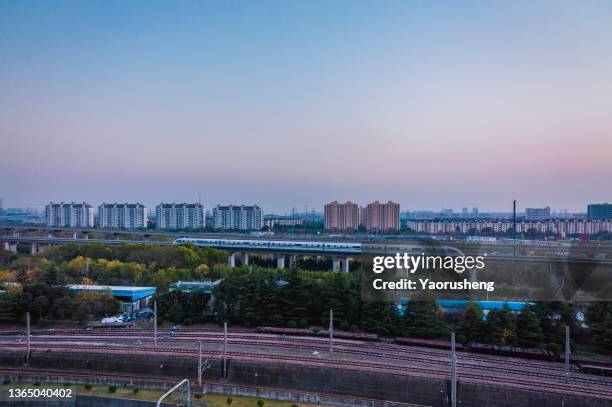 shanghai magnetic levitation (maglev) train departure for pudong airport.this train link pudong international airport with shanghai downtown area - suburban downtown stock pictures, royalty-free photos & images